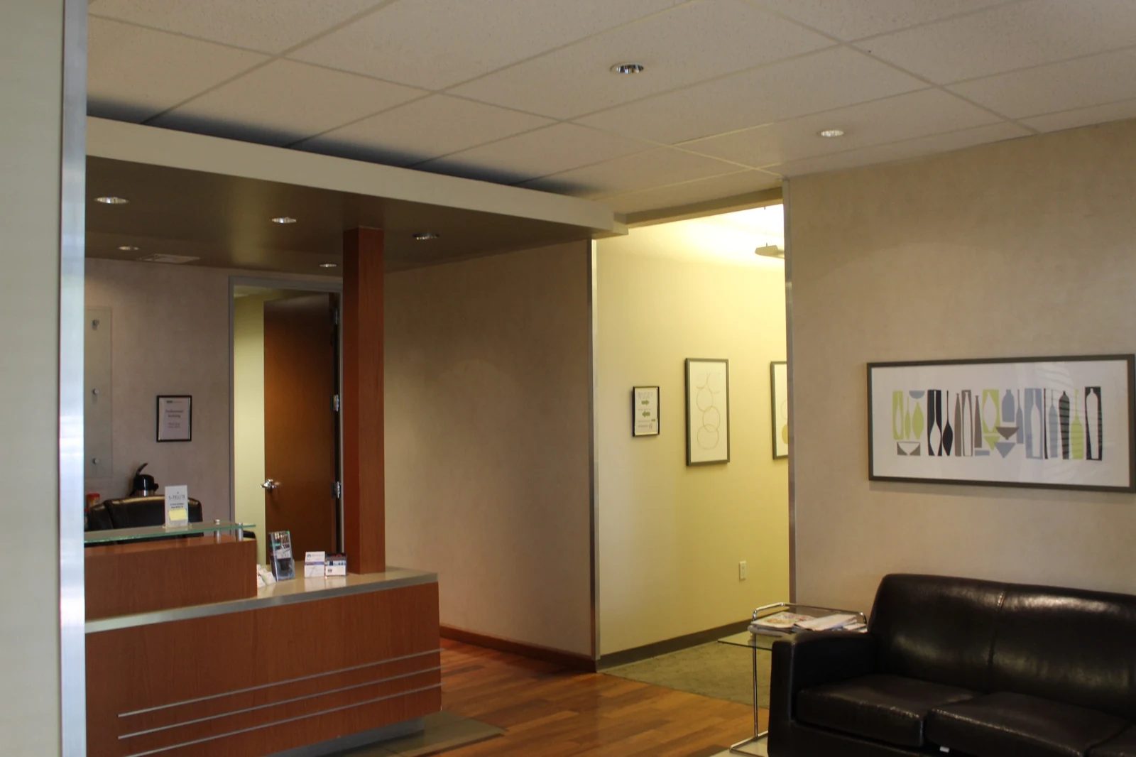 Lobby at Gateway Executive Suites, 500 East E Street with reception counter, sofa and wall artwork