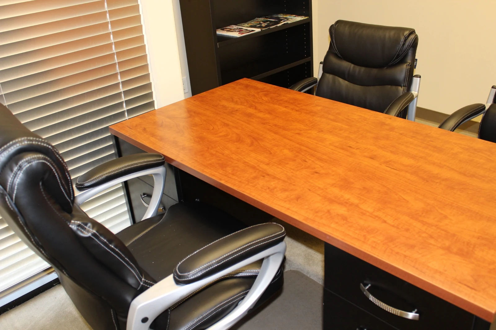 Desk and seating details in a furnished office at Gateway Executive Suites, 500 East E Street