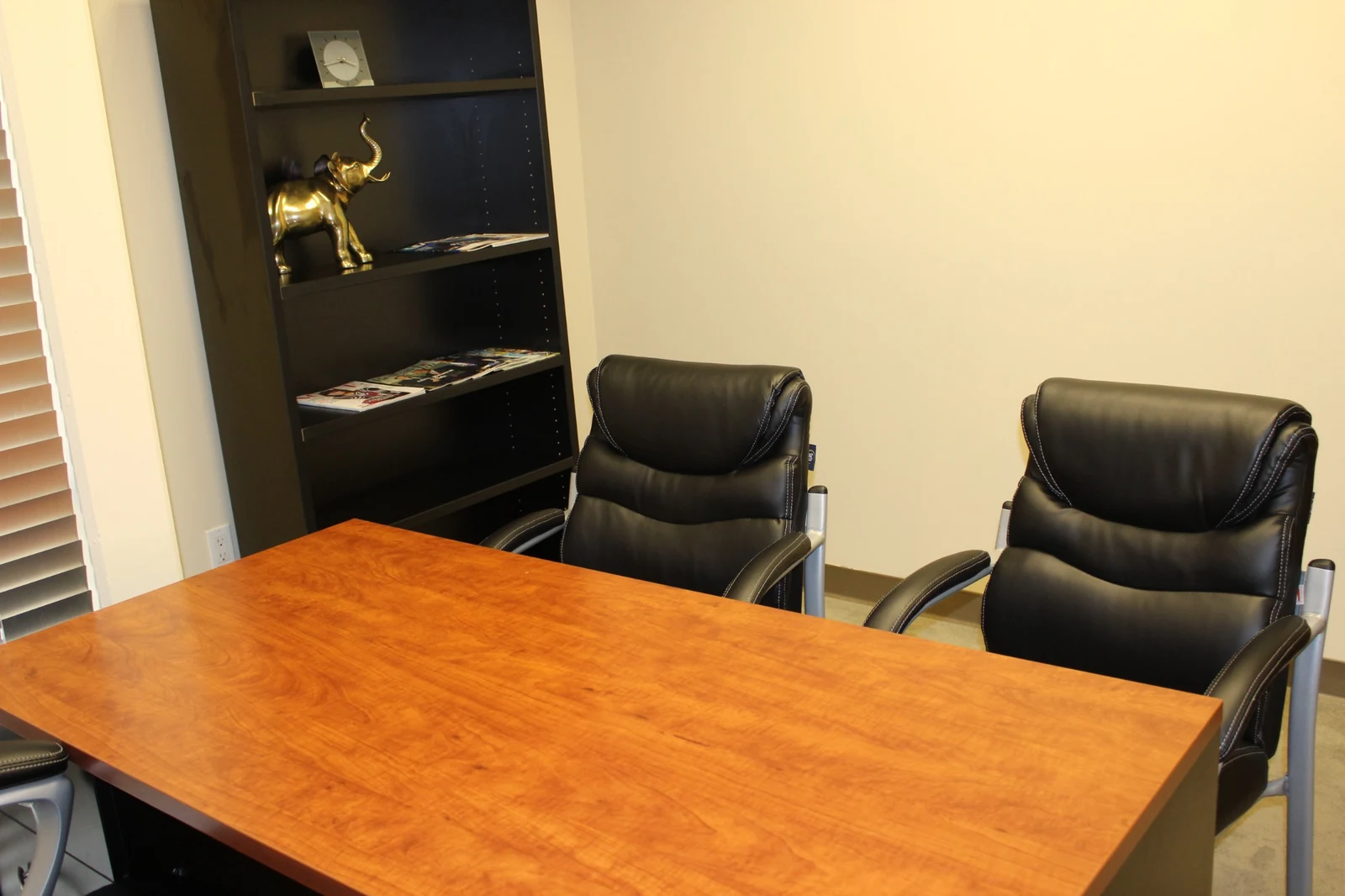 Two guest chairs facing the desk in an office at Gateway Executive Suites, 500 East E Street