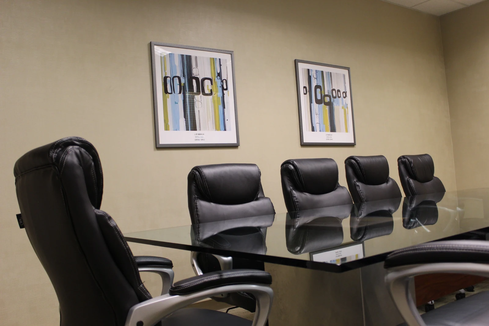 Padded black conference chairs and framed artwork at Gateway Executive Suites, 500 East E Street