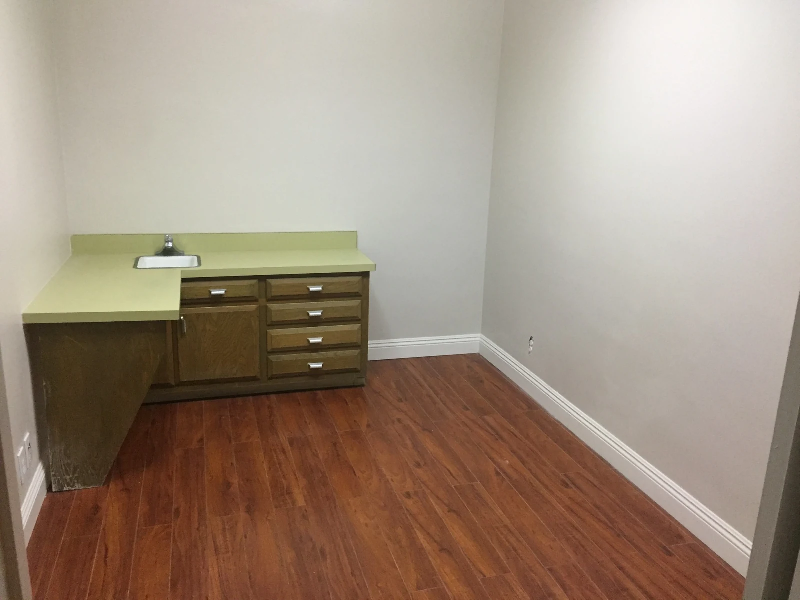 Ontario Executive Suites: office with a green counter, sink and built-in storage at 525 N Laurel Avenue