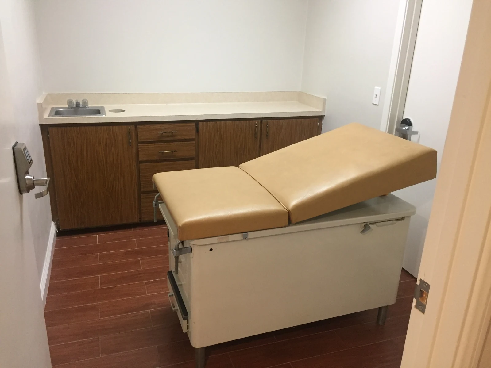 Room at Ontario Executive Suites, 525 N Laurel Avenue photographed with an examination table, sink and cabinetry