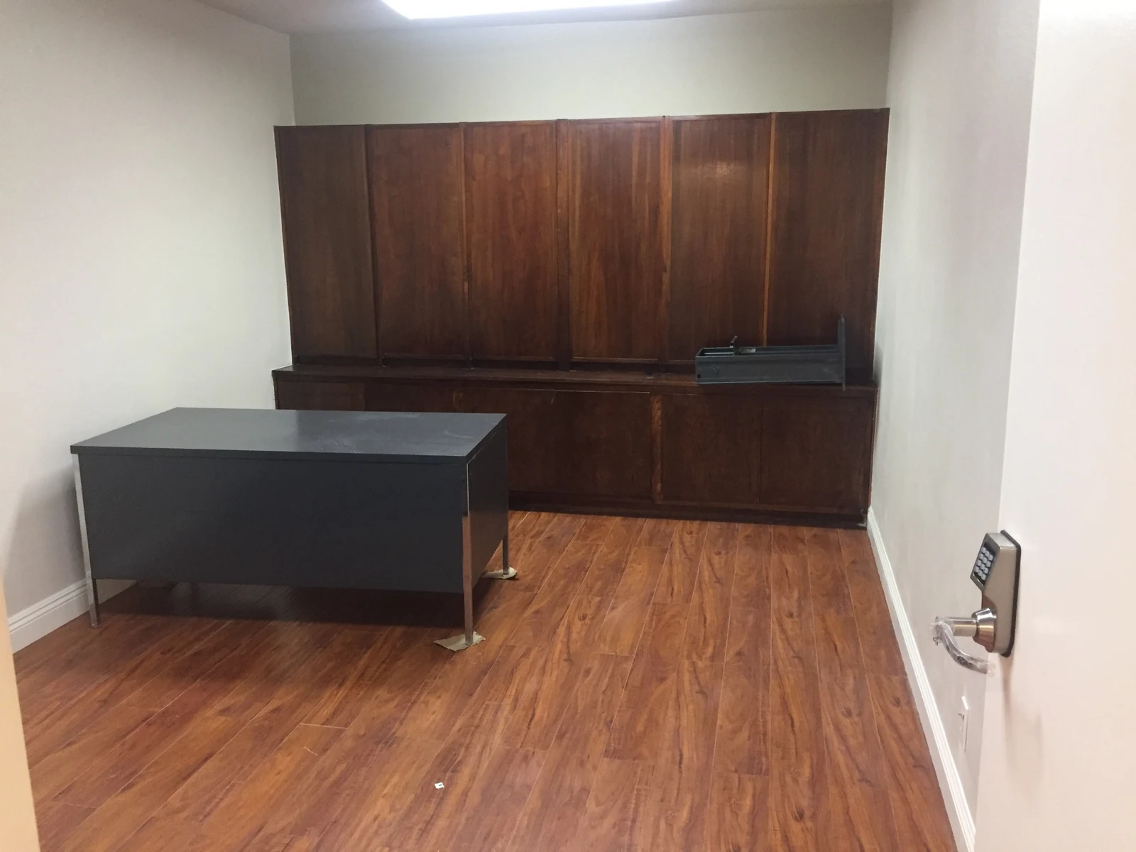 Office at Ontario Executive Suites, 525 N Laurel Avenue with a gray desk and built-in wood cabinets
