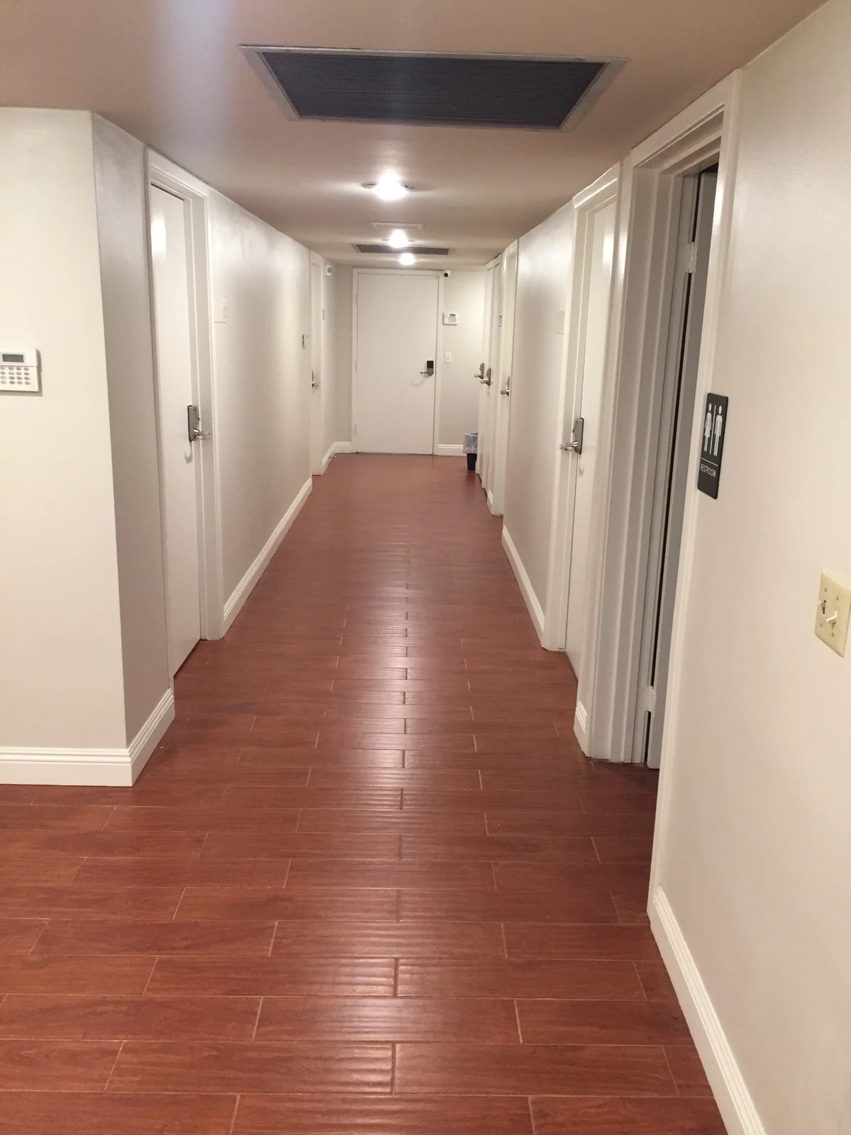 Interior corridor at Ontario Executive Suites, 525 N Laurel Avenue with white office doors