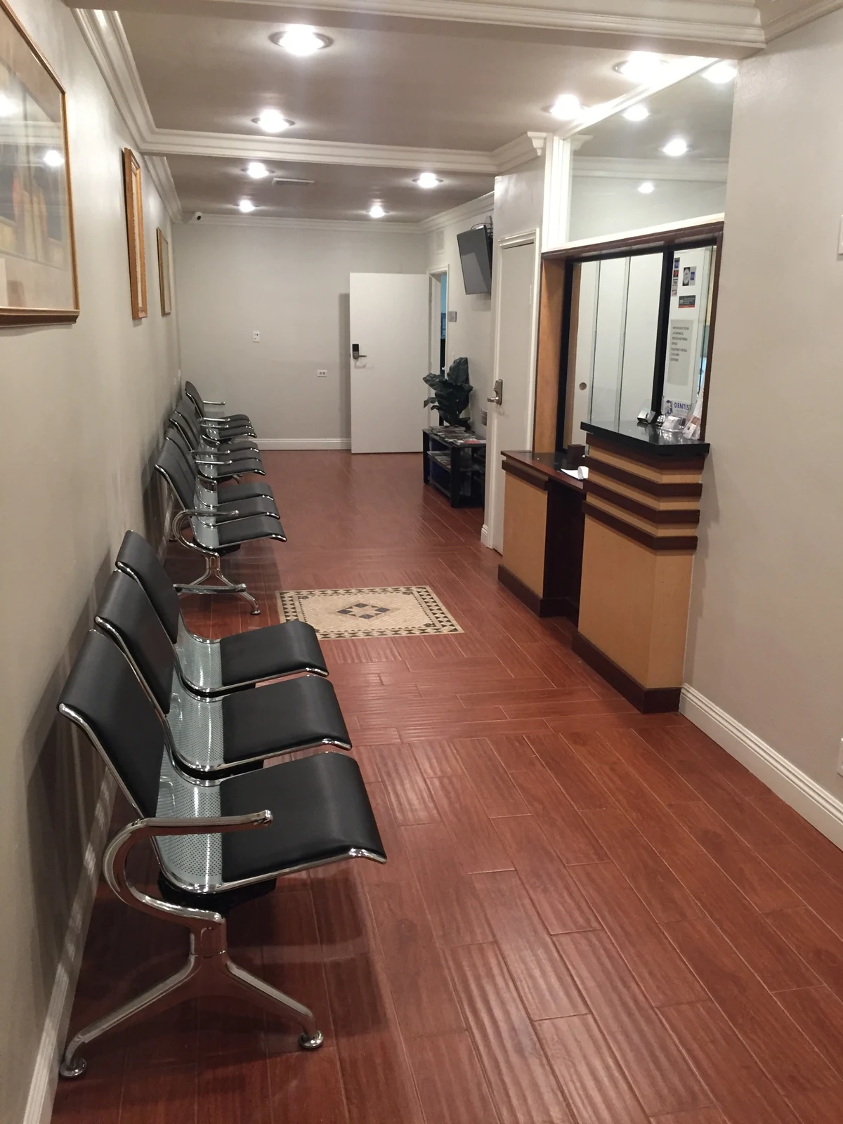 Ontario Executive Suites: waiting area with seating, artwork and glazed reception counter at 525 N Laurel Avenue