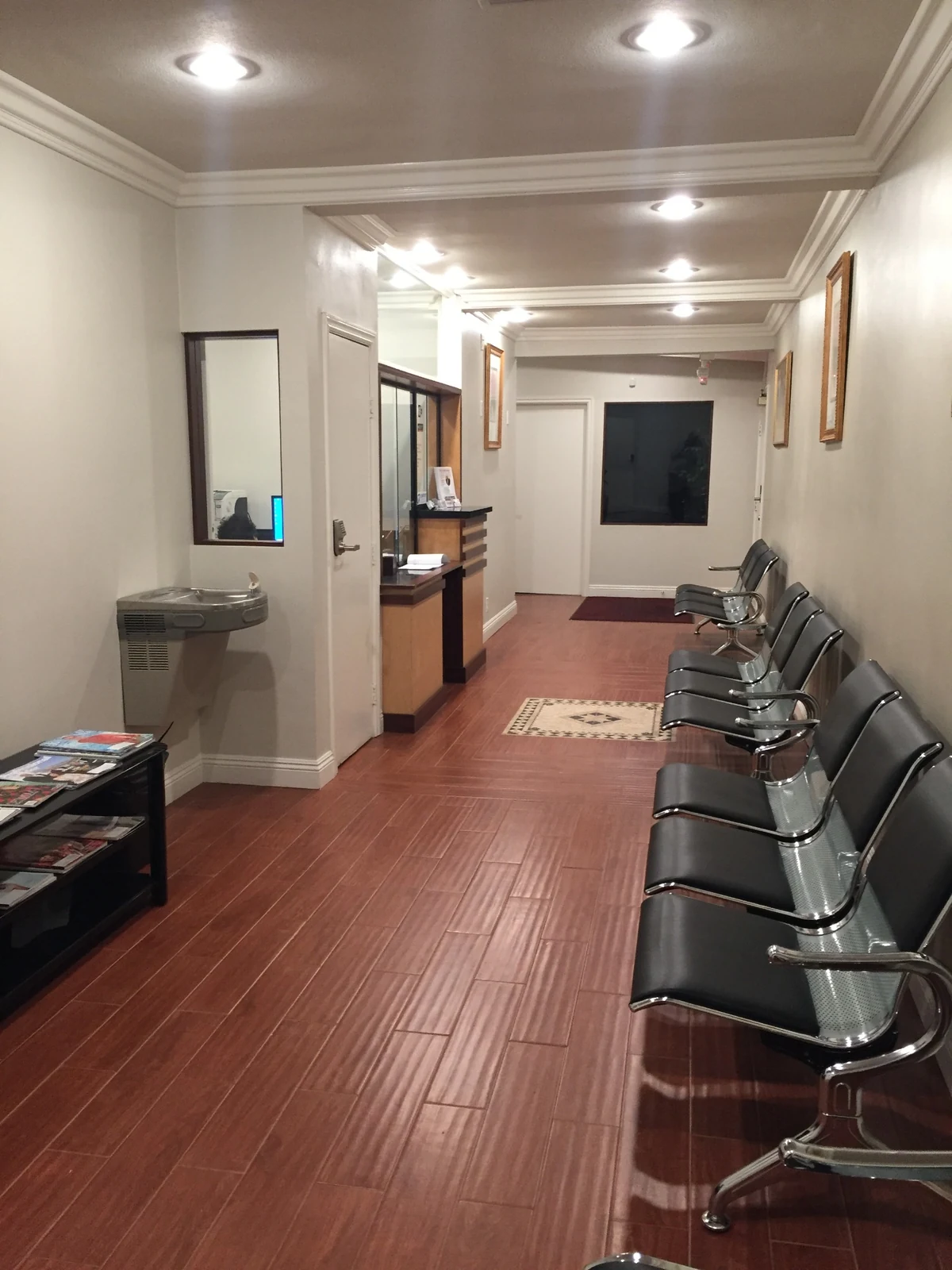 Waiting area at Ontario Executive Suites, 525 N Laurel Avenue with reception counter, visitor seating and drinking fountain